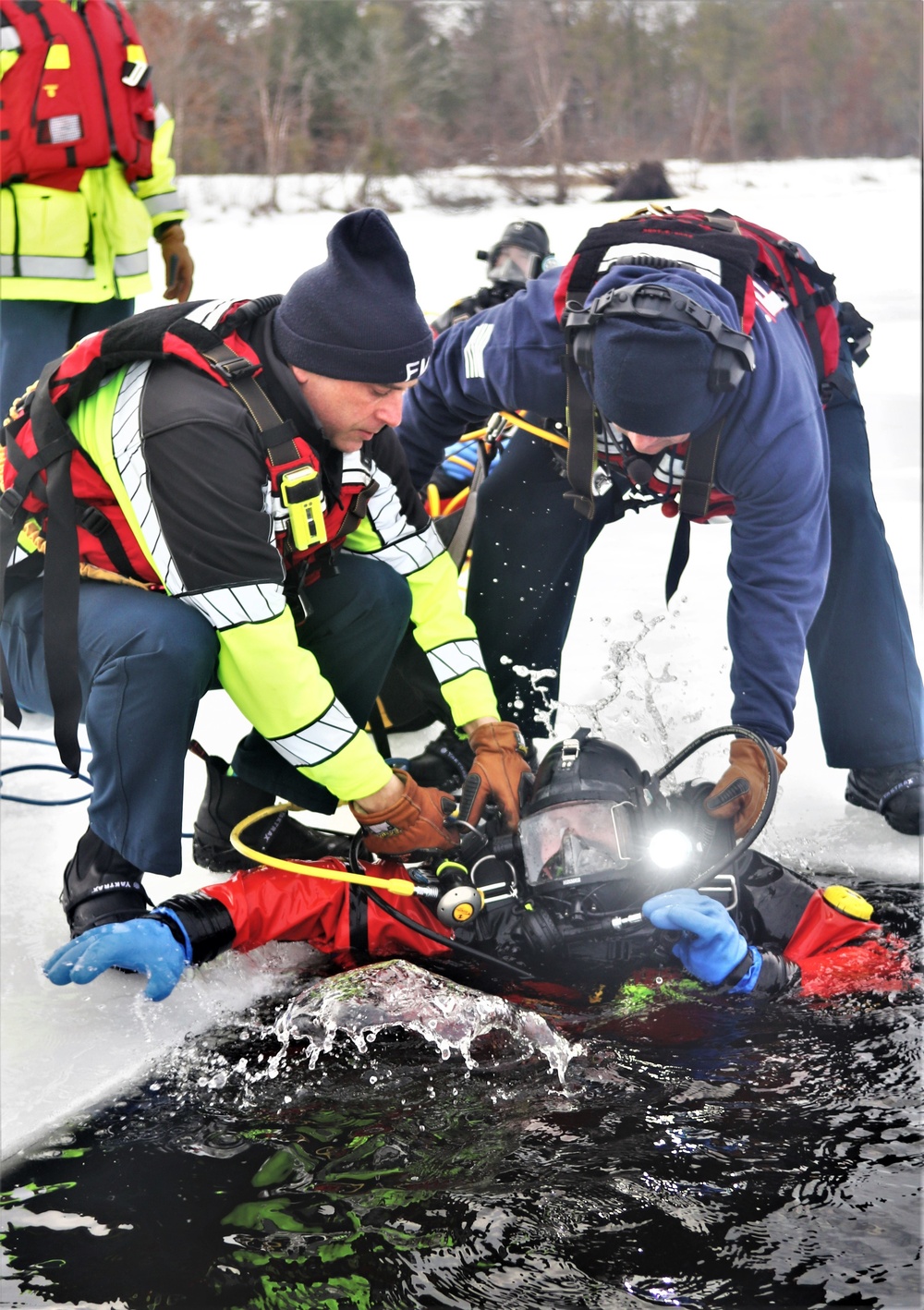 Fort McCoy Fire Department dive team conducts ice rescue training at frozen lake at Fort McCoy