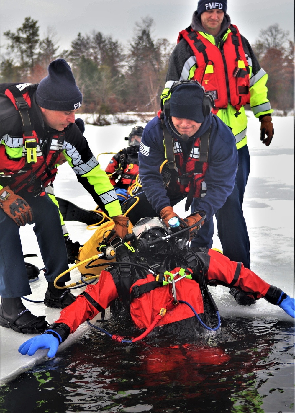 Fort McCoy Fire Department dive team conducts ice rescue training at frozen lake at Fort McCoy