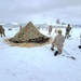 Airmen learn to build Arctic 10-person tents during cold-weather training at Fort McCoy