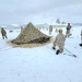 Airmen learn to build Arctic 10-person tents during cold-weather training at Fort McCoy