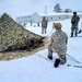 Airmen learn to build Arctic 10-person tents during cold-weather training at Fort McCoy