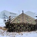 Airmen learn to build Arctic 10-person tents during cold-weather training at Fort McCoy