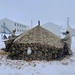 Airmen learn to build Arctic 10-person tents during cold-weather training at Fort McCoy