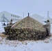 Airmen learn to build Arctic 10-person tents during cold-weather training at Fort McCoy