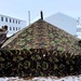 Airmen learn to build Arctic 10-person tents during cold-weather training at Fort McCoy