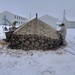 Airmen learn to build Arctic 10-person tents during cold-weather training at Fort McCoy