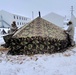 Airmen learn to build Arctic 10-person tents during cold-weather training at Fort McCoy