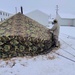 Airmen learn to build Arctic 10-person tents during cold-weather training at Fort McCoy