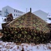 Airmen learn to build Arctic 10-person tents during cold-weather training at Fort McCoy