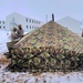 Airmen learn to build Arctic 10-person tents during cold-weather training at Fort McCoy