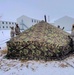 Airmen learn to build Arctic 10-person tents during cold-weather training at Fort McCoy