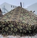 Airmen learn to build Arctic 10-person tents during cold-weather training at Fort McCoy