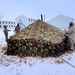 Airmen learn to build Arctic 10-person tents during cold-weather training at Fort McCoy