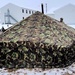 Airmen learn to build Arctic 10-person tents during cold-weather training at Fort McCoy