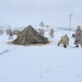 Airmen learn to build Arctic 10-person tents during cold-weather training at Fort McCoy