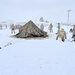 Airmen learn to build Arctic 10-person tents during cold-weather training at Fort McCoy