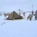 Airmen learn to build Arctic 10-person tents during cold-weather training at Fort McCoy