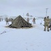 Airmen learn to build Arctic 10-person tents during cold-weather training at Fort McCoy