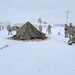 Airmen learn to build Arctic 10-person tents during cold-weather training at Fort McCoy