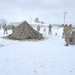 Airmen learn to build Arctic 10-person tents during cold-weather training at Fort McCoy