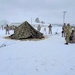 Airmen learn to build Arctic 10-person tents during cold-weather training at Fort McCoy