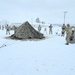 Airmen learn to build Arctic 10-person tents during cold-weather training at Fort McCoy