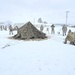 Airmen learn to build Arctic 10-person tents during cold-weather training at Fort McCoy