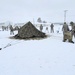 Airmen learn to build Arctic 10-person tents during cold-weather training at Fort McCoy