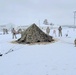 Airmen learn to build Arctic 10-person tents during cold-weather training at Fort McCoy