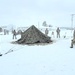 Airmen learn to build Arctic 10-person tents during cold-weather training at Fort McCoy