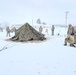 Airmen learn to build Arctic 10-person tents during cold-weather training at Fort McCoy