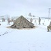 Airmen learn to build Arctic 10-person tents during cold-weather training at Fort McCoy