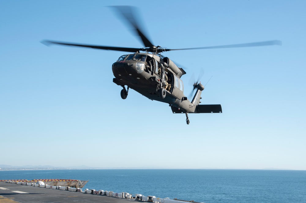 USS Tripoli Conducts Flight Ops with HSC-23 and 16th Combat Aviation Brigade