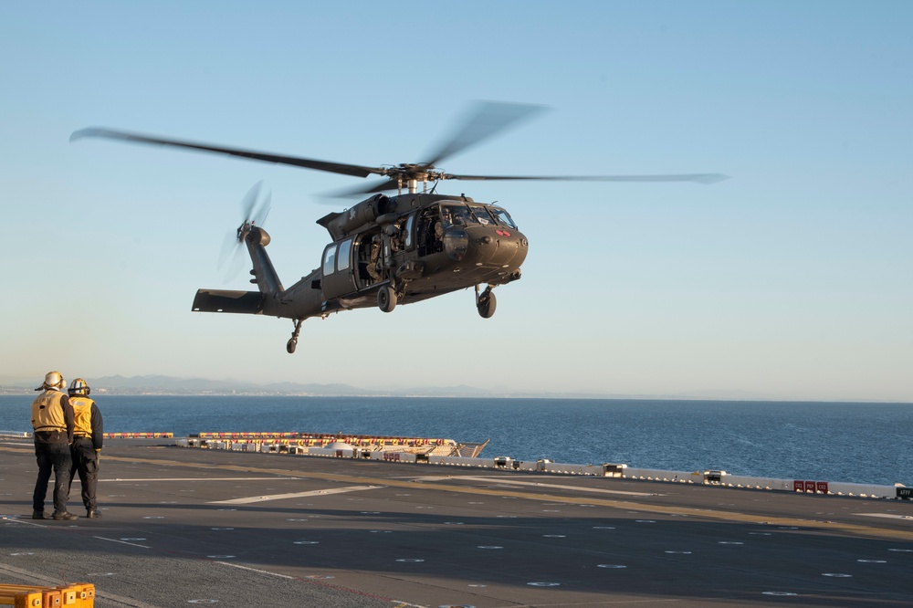 USS Tripoli Conducts Flight Operations the U.S. Army's 16th Combat Aviation Brigade