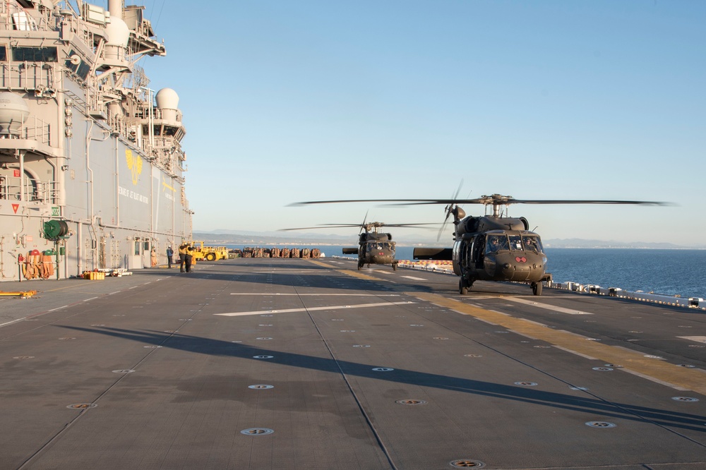 USS Tripoli Conducts Flight Operations the U.S. Army's 16th Combat Aviation Brigade