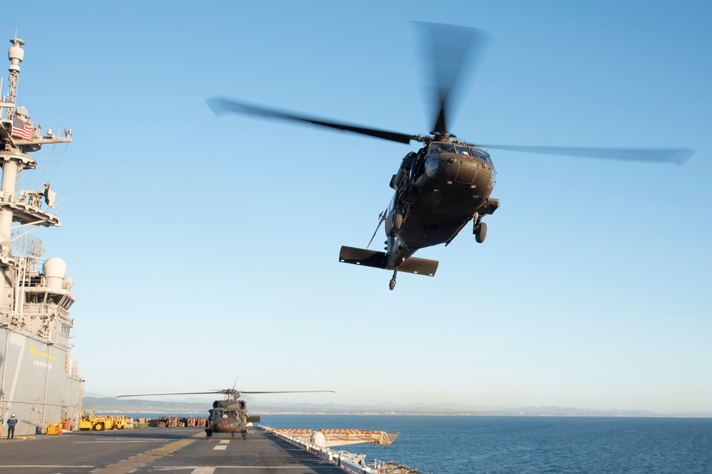 USS Tripoli Conducts Flight Operations the U.S. Army's 16th Combat Aviation Brigade