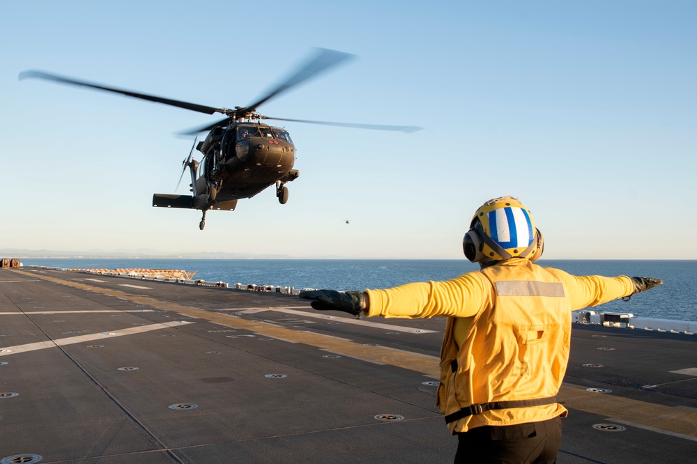 USS Tripoli Conducts Flight Operations the U.S. Army's 16th Combat Aviation Brigade