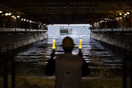 Marines And Sailors Conduct Well Deck Operations Aboard USS Bataan