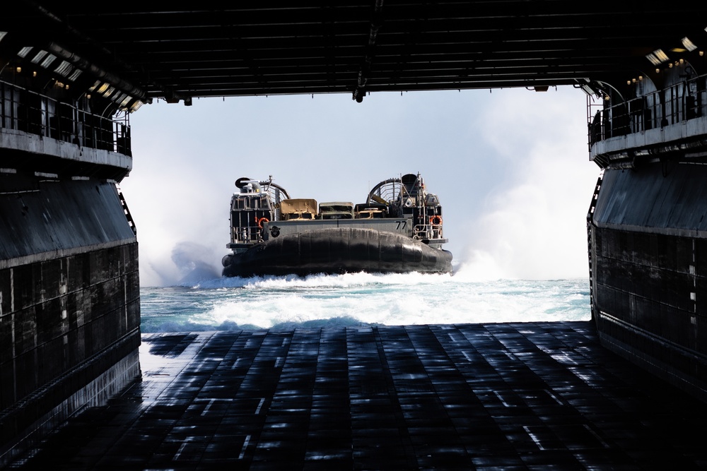 Marines And Sailors Conduct Well Deck Operations Aboard USS Bataan