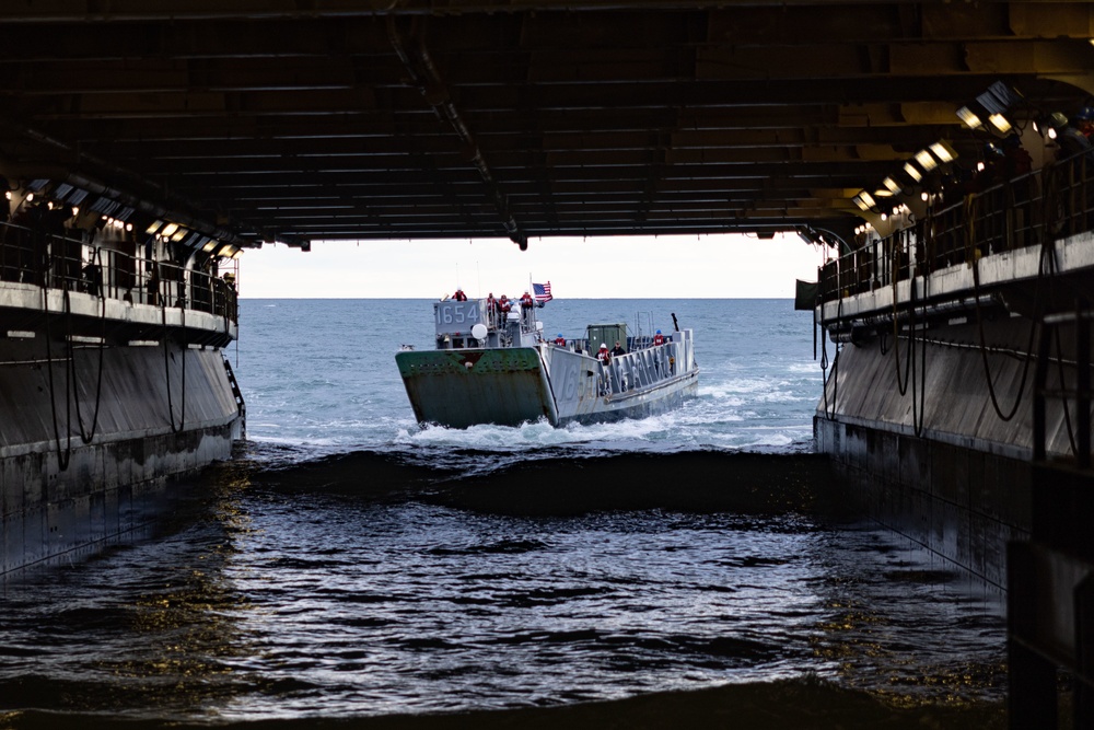 Marines And Sailors Conduct Well Deck Operations Aboard USS Bataan