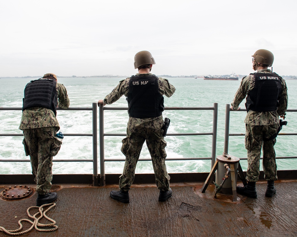 Sailors Observe USS Nimitz Leaving Port