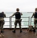 Sailors Observe USS Nimitz Leaving Port