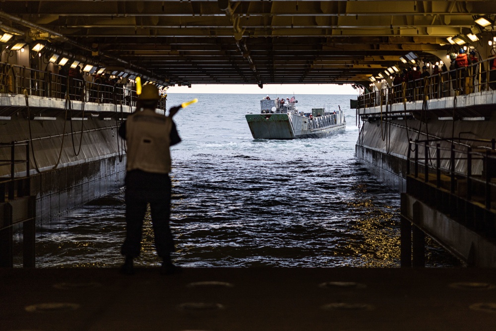 Marines And Sailors Conduct Well Deck Operations Aboard USS Bataan