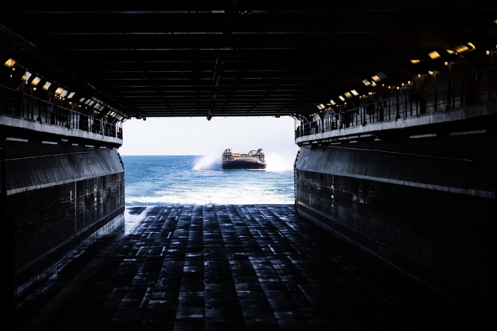 Marines And Sailors Conduct Well Deck Operations Aboard USS Bataan