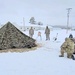 Airmen learn to build Arctic 10-person tents during cold-weather training at Fort McCoy