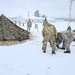 Airmen learn to build Arctic 10-person tents during cold-weather training at Fort McCoy