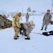 Airmen learn to build Arctic 10-person tents during cold-weather training at Fort McCoy