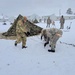 Airmen learn to build Arctic 10-person tents during cold-weather training at Fort McCoy