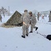 Airmen learn to build Arctic 10-person tents during cold-weather training at Fort McCoy