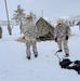 Airmen learn to build Arctic 10-person tents during cold-weather training at Fort McCoy